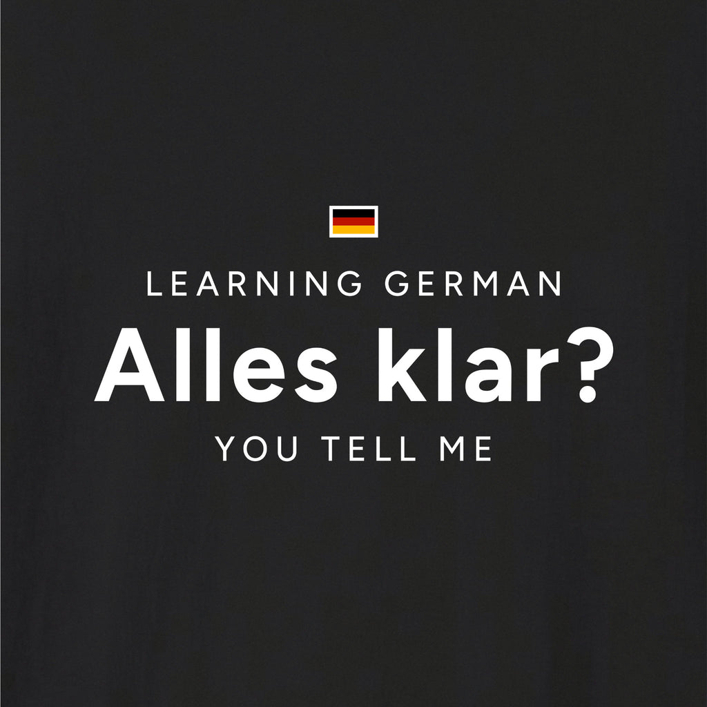 Close-up of Black German learner T-shirt featuring the “Alles Klar?” print