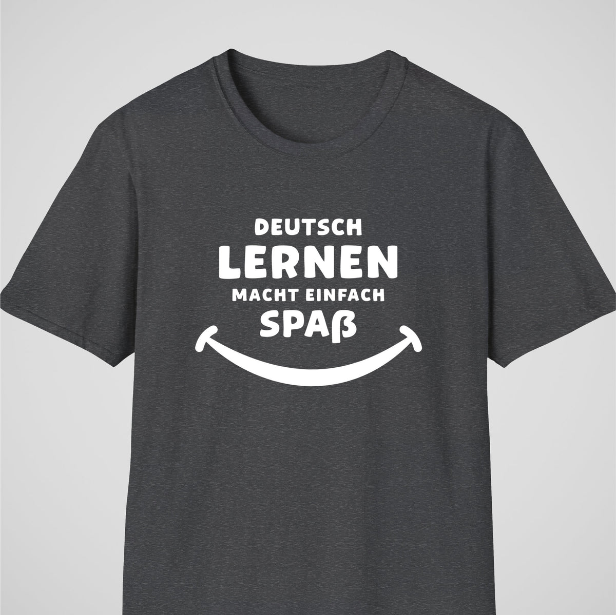 Dark Heather German learner T-shirt featuring the “Deutsch Macht Spa” design