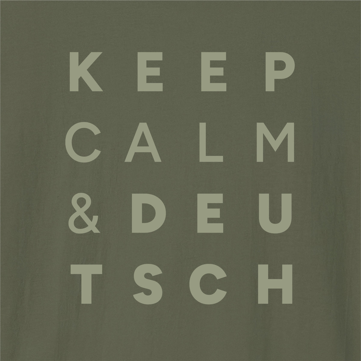 Close-up of Military Green German learner T-shirt featuring the “Keep Calm & Deutsch” print