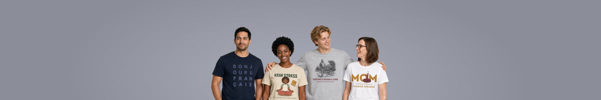 Four people wearing French, German, Italian and Spanish language T-Shirts