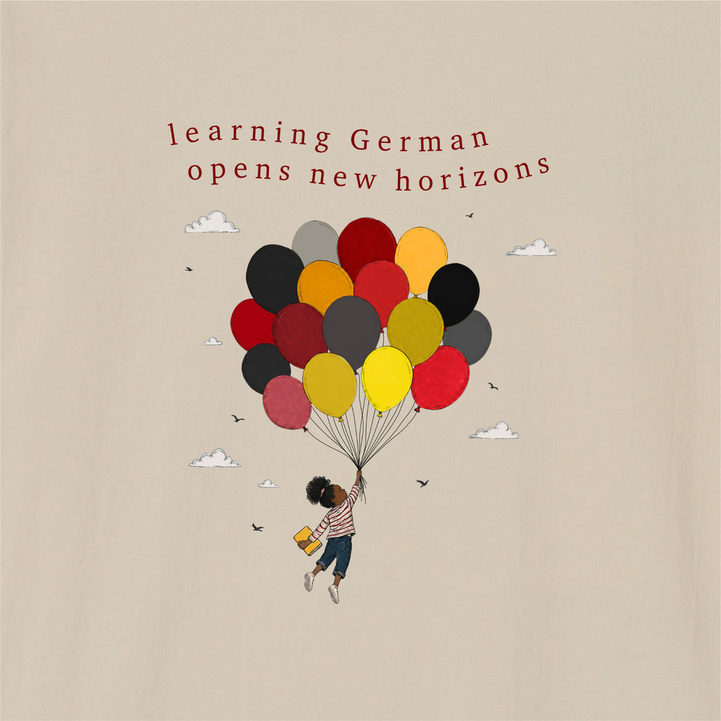 Close-up of Sand German learner T-shirt featuring the “New Horizons German” print
