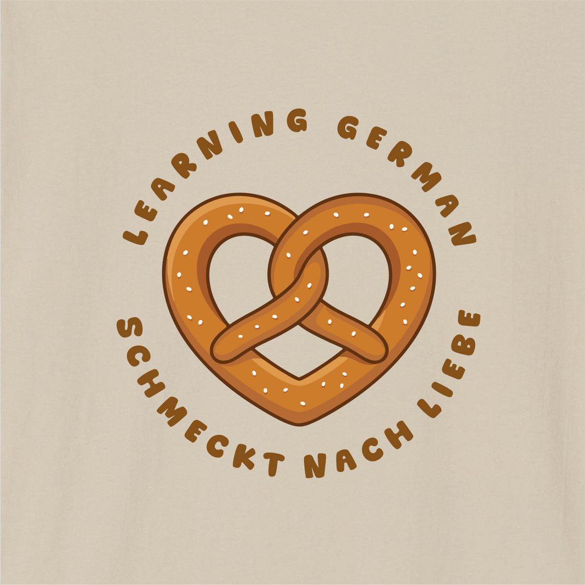 Close-up of Sand German learner T-shirt featuring the “Schmeckt Nach Liebe” print