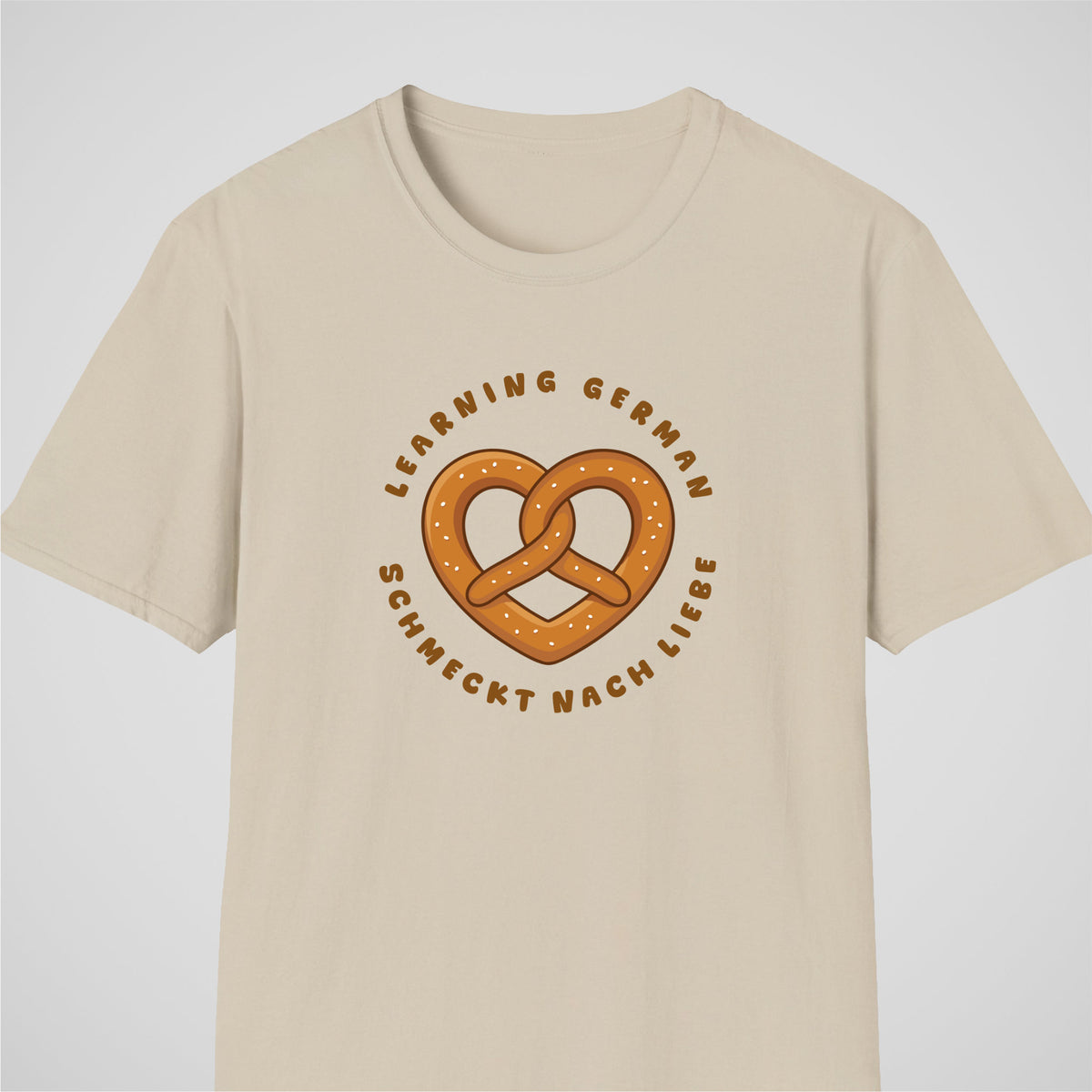 Sand German learner T-shirt featuring the “Schmeckt Nach Liebe” design